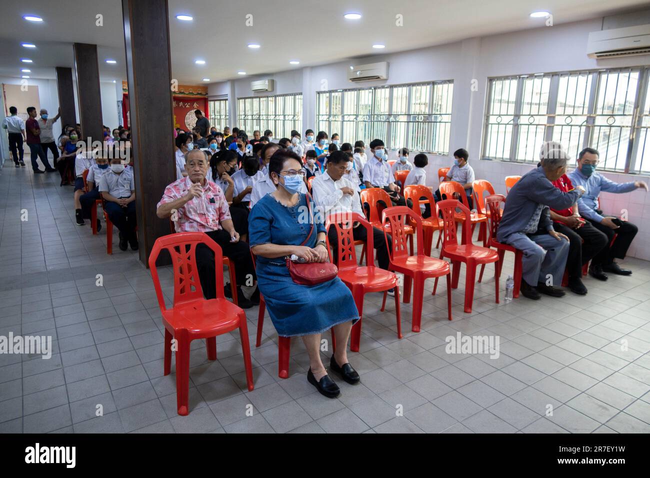 Sarawak Chai's Clan Association members clean up documents after fire