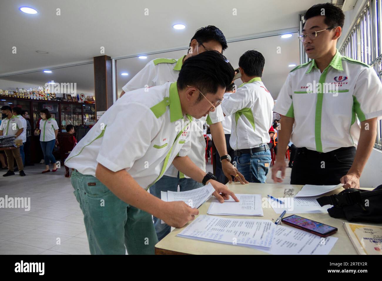 Sarawak Chai's Clan Youth Section giving away school bags, uniforms