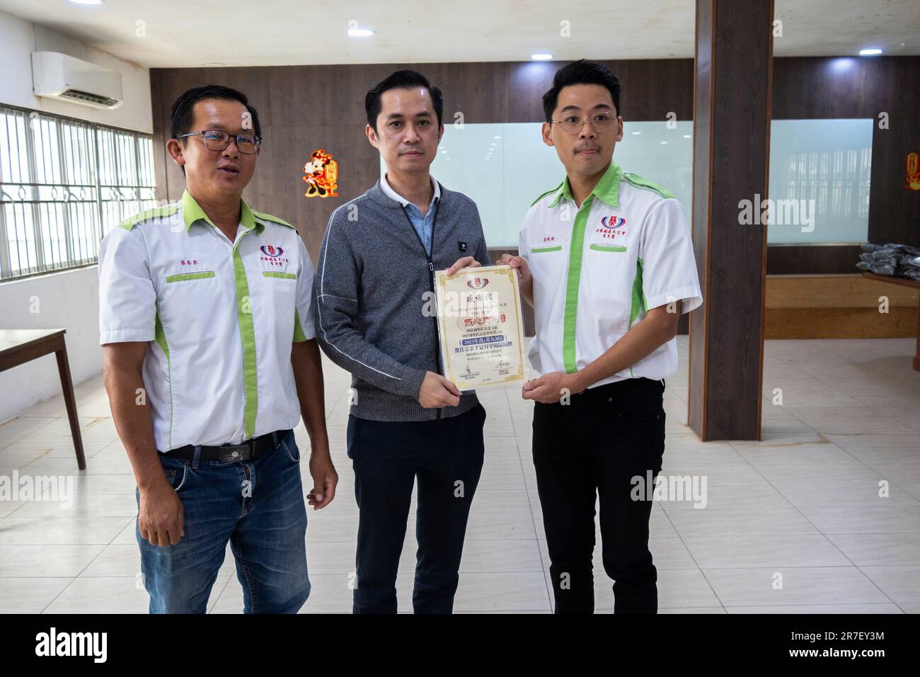 Sarawak Chai's Clan Youth Section giving away school bags, uniforms