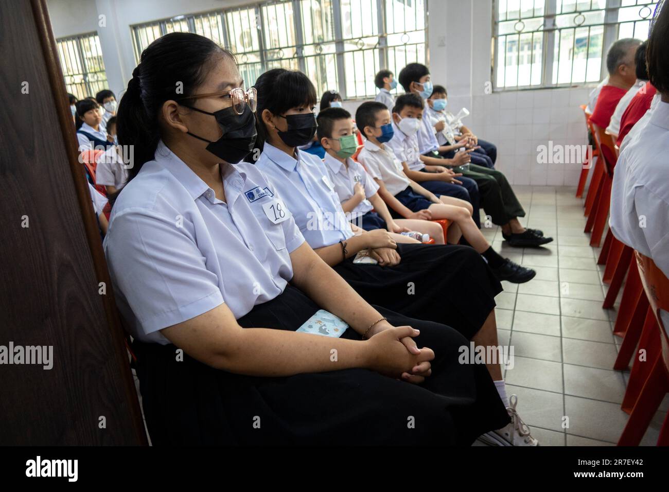 Sarawak Chai's Clan Youth Section giving away school bags, uniforms