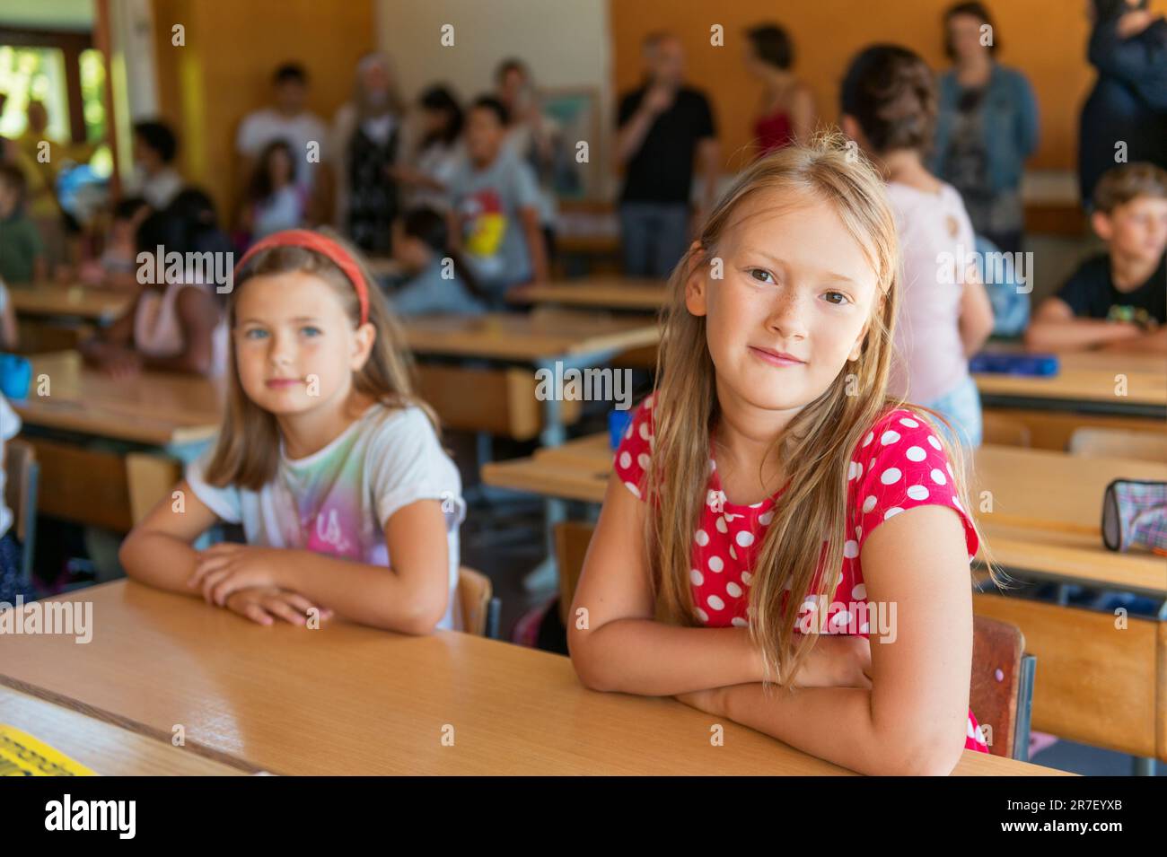 Indoor portrait of a cute little girls in a classroom Stock Photo