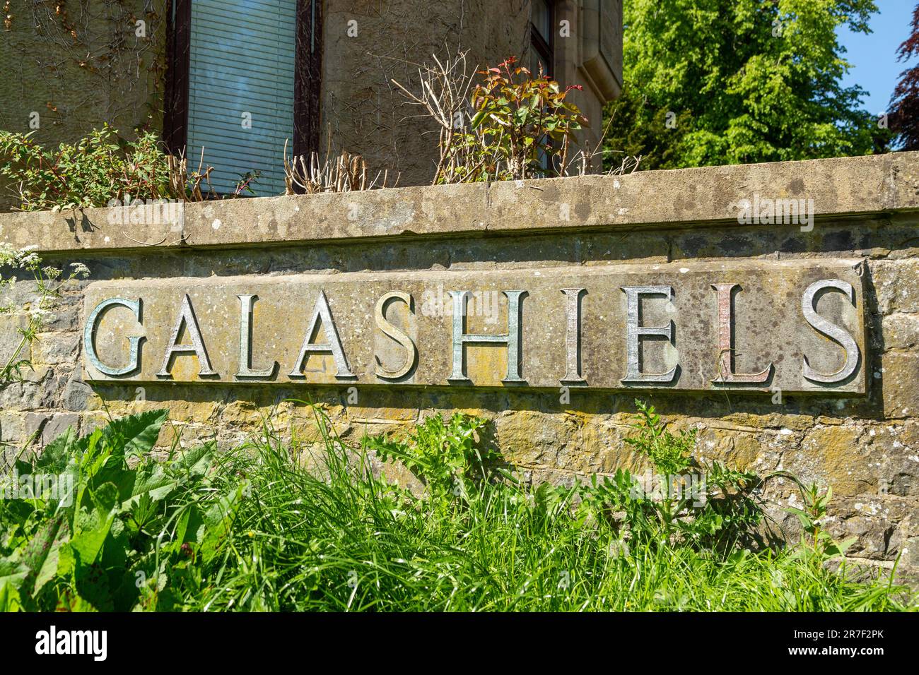A sign at the entrance to galashiels academy Stock Photo Alamy