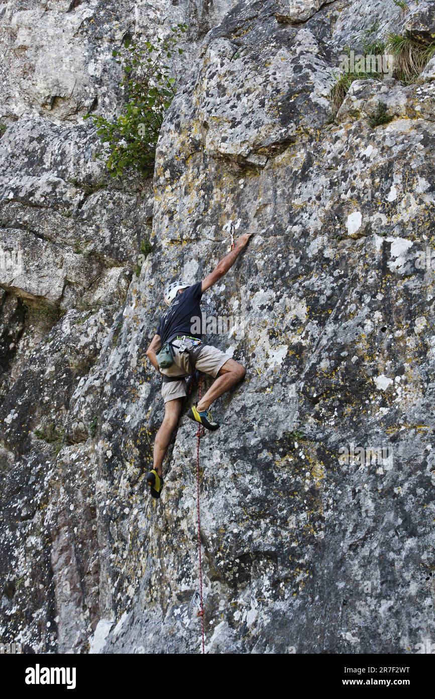 Man climbing a rock hi-res stock photography and images - Alamy