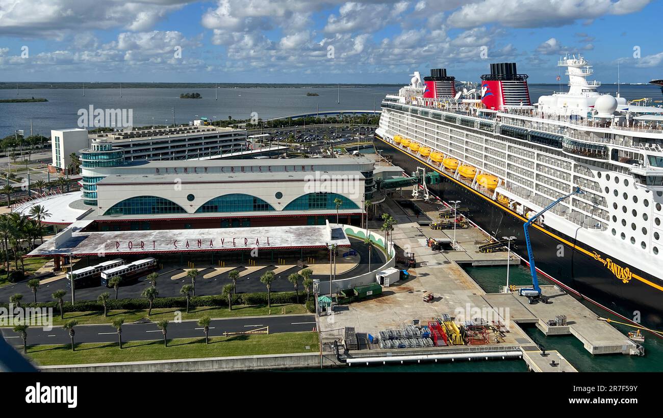 Orlando, FL USA - January 8, 2022:  The Disney Cruise line building and cruise ship Fantasy at dock in Port Canaveral, Florida. Stock Photo