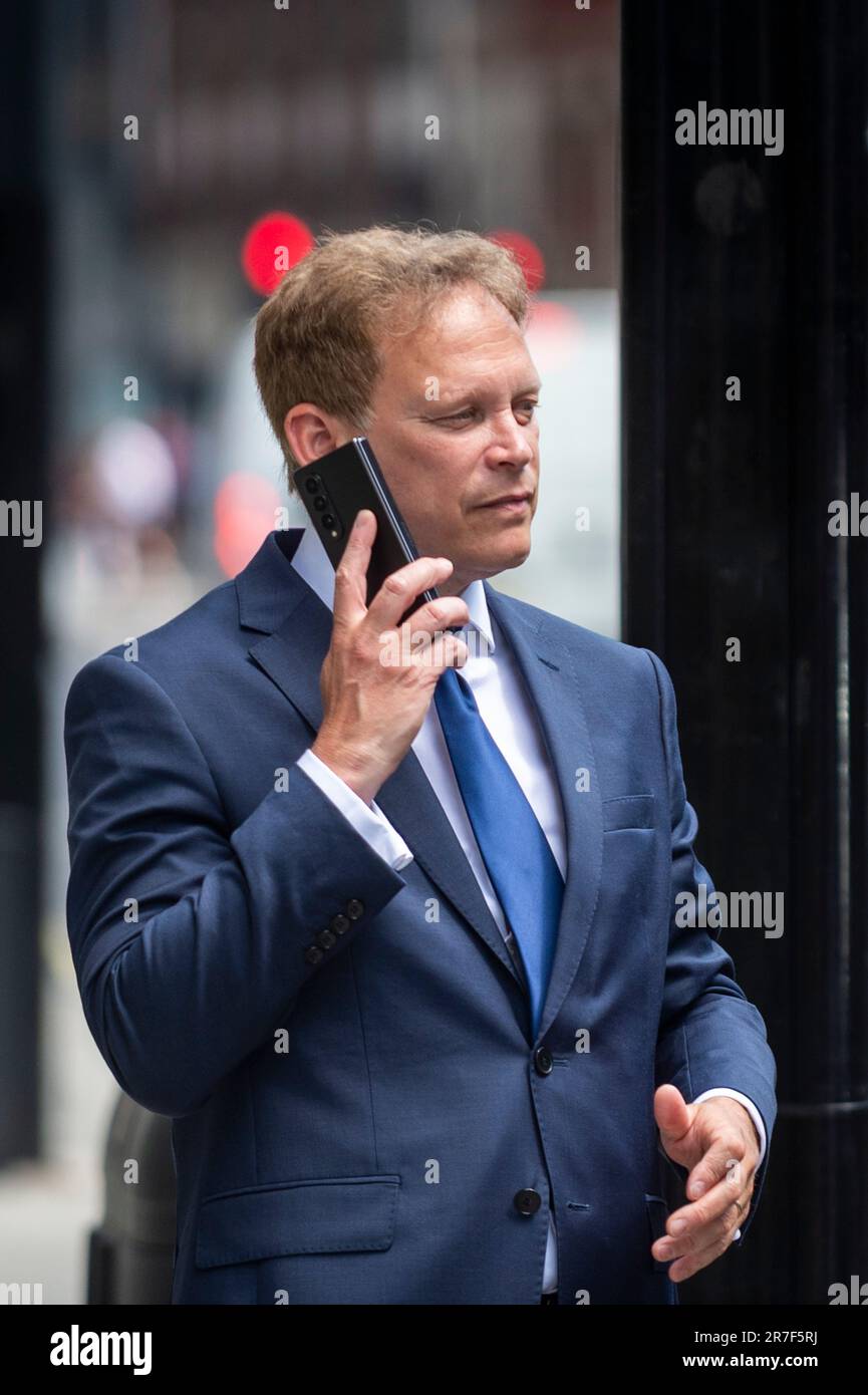 London, UK.  15 June 2023.  Grant Shapps, Secretary of State for Energy Security and Net Zero, on his phone at lunchtime outside The Ivy Restaurant Victoria in Westminster ahead of being collected by his driver.  Credit: Stephen Chung / Alamy Live News Stock Photo