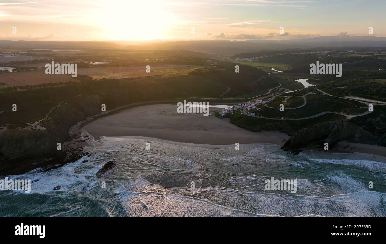 Aerial view of Praia de Odeceixe along Ribeira de Seixe river, Odeceixe ...