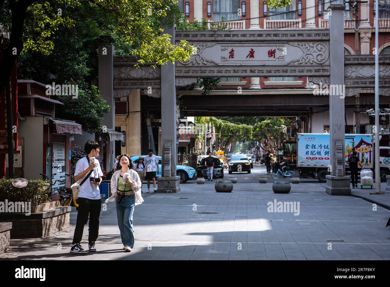 (230615) -- WUHAN, June 15, 2023 (Xinhua) -- Tourists visit Jiqing Street of Hankou historical area in Wuhan, central China's Hubei Province, June 6, 2023. Covering an area of 6.02 square kilometers, the Hankou historical area in the heart of Wuhan City's old town, boasts an abundance of historical and cultural heritages.    In recent years, Wuhan City has undertaken many urban renewal projects to revitalize this area's aging buildings. The historical area has seen significant changes through those efforts. (Xinhua/Wu Zhizun) Stock Photo