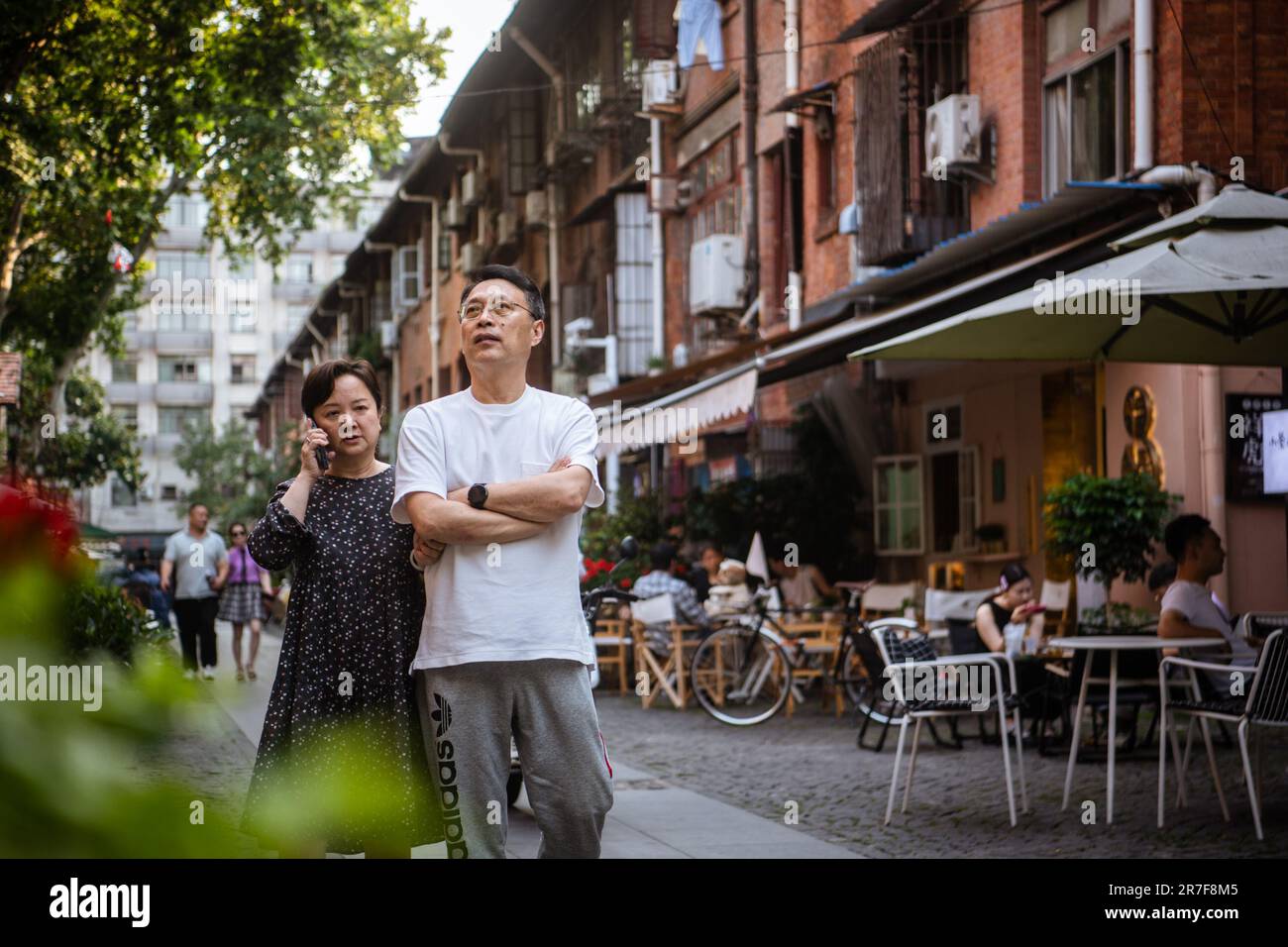 (230615) -- WUHAN, June 15, 2023 (Xinhua) -- Tourists visit Lihuangpi Street of Hankou historical area in Wuhan, central China's Hubei Province, June 6, 2023. Covering an area of 6.02 square kilometers, the Hankou historical area in the heart of Wuhan City's old town, boasts an abundance of historical and cultural heritages.    In recent years, Wuhan City has undertaken many urban renewal projects to revitalize this area's aging buildings. The historical area has seen significant changes through those efforts. (Xinhua/Wu Zhizun) Stock Photo