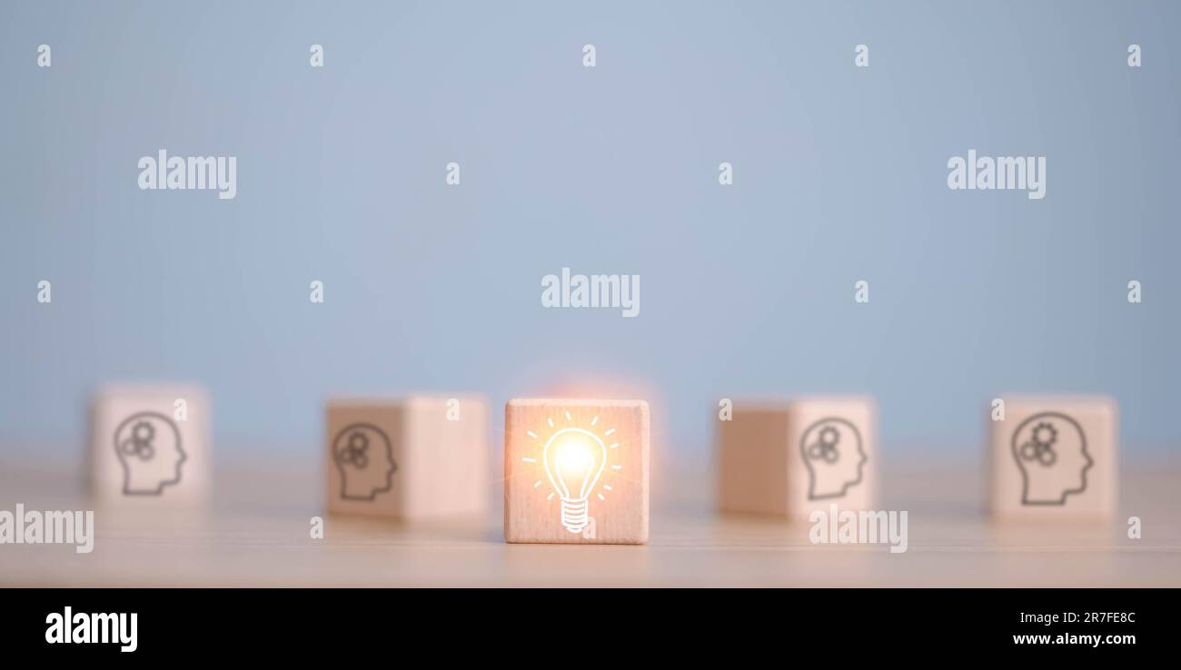 Concept creative idea and innovation.wooden cube block with head human symbol and light bulb icon Stock Photo