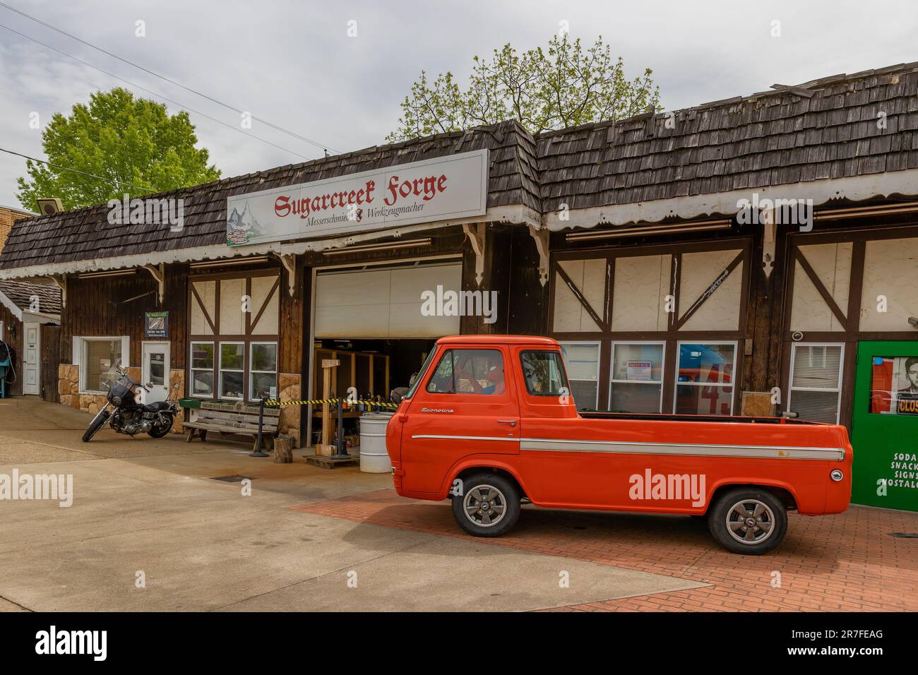Sugarcreek, Ohio, USA May 16, 2023 Inflatable Superman sits inside a red vehicle infront of a