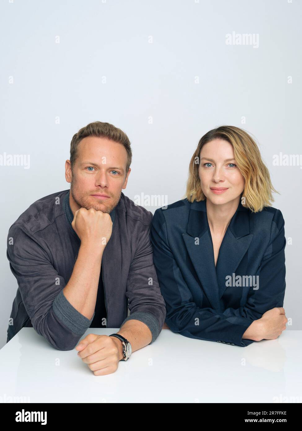 Sam Heughan, left, and Caitriona Balfe pose for a portrait to promote