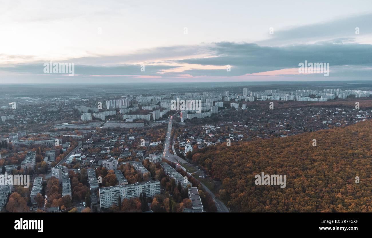 Aerial autumn evening city view. Residential district with park and scenic cloudy sky. Kharkiv, Ukraine Stock Photo