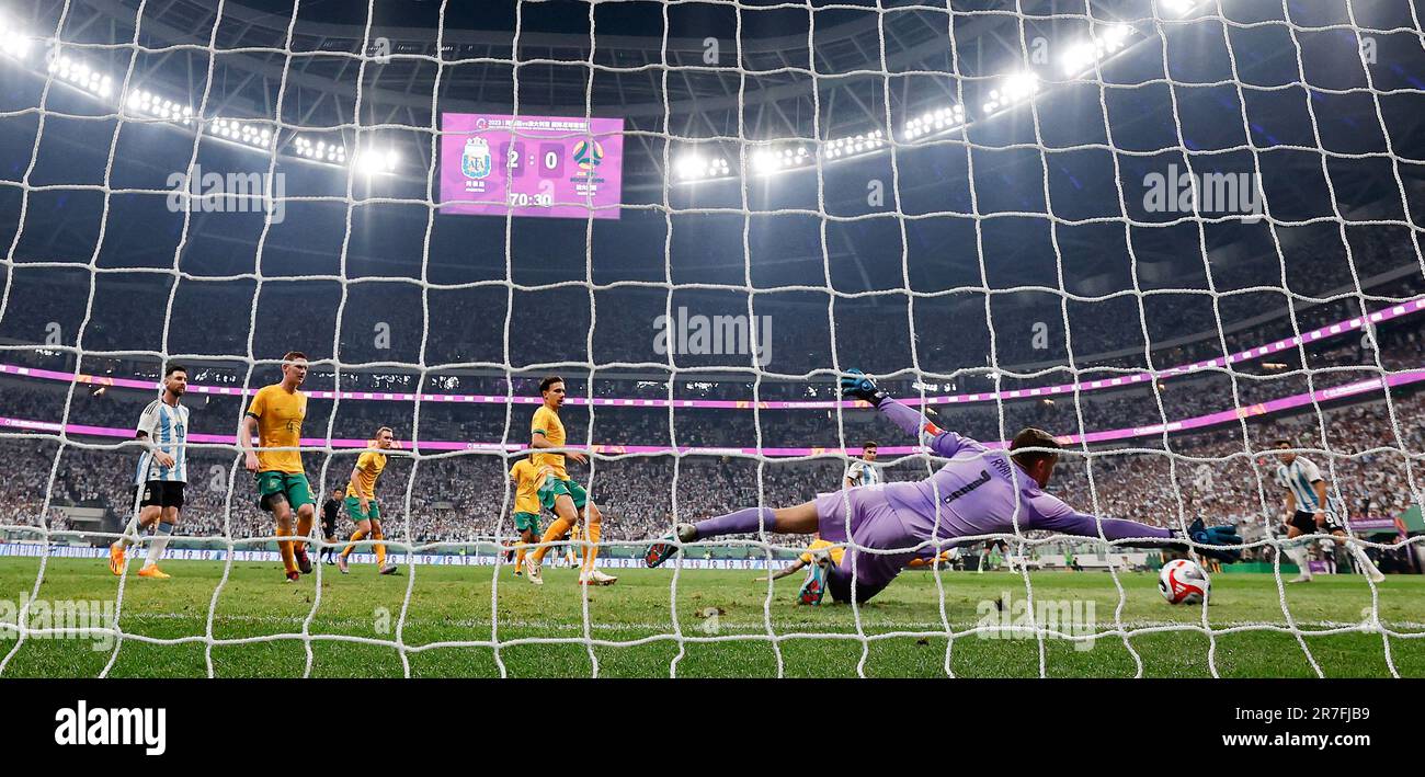 Beijing, China. 15th June, 2023. Mathew Ryan, goalkeeper of Australia, makes a save during an international football invitational between Argentina and Australia in Beijing, capital of China, June 15, 2023. Credit: Wang Lili/Xinhua/Alamy Live News Stock Photo