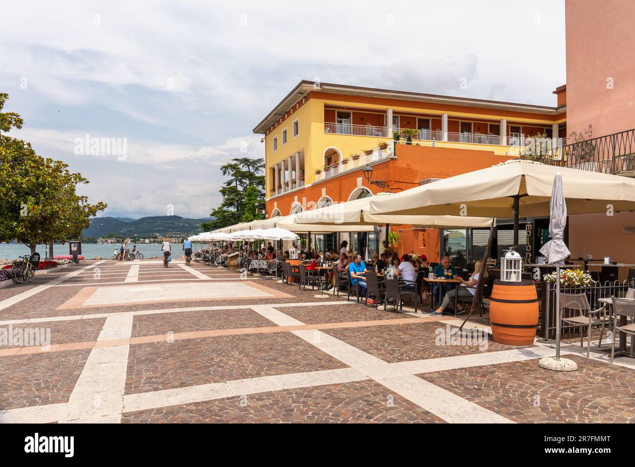 Bars and restaurants along the wide promenade in Bardolino, Lake Garda, Italy, Europe Stock Photo