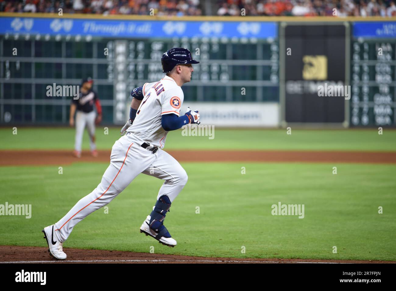 Houston Astros third baseman Alex Bregman (2) runs to first after hitting a single to right in the bottom of the seventh inning during the MLB game be Stock Photo