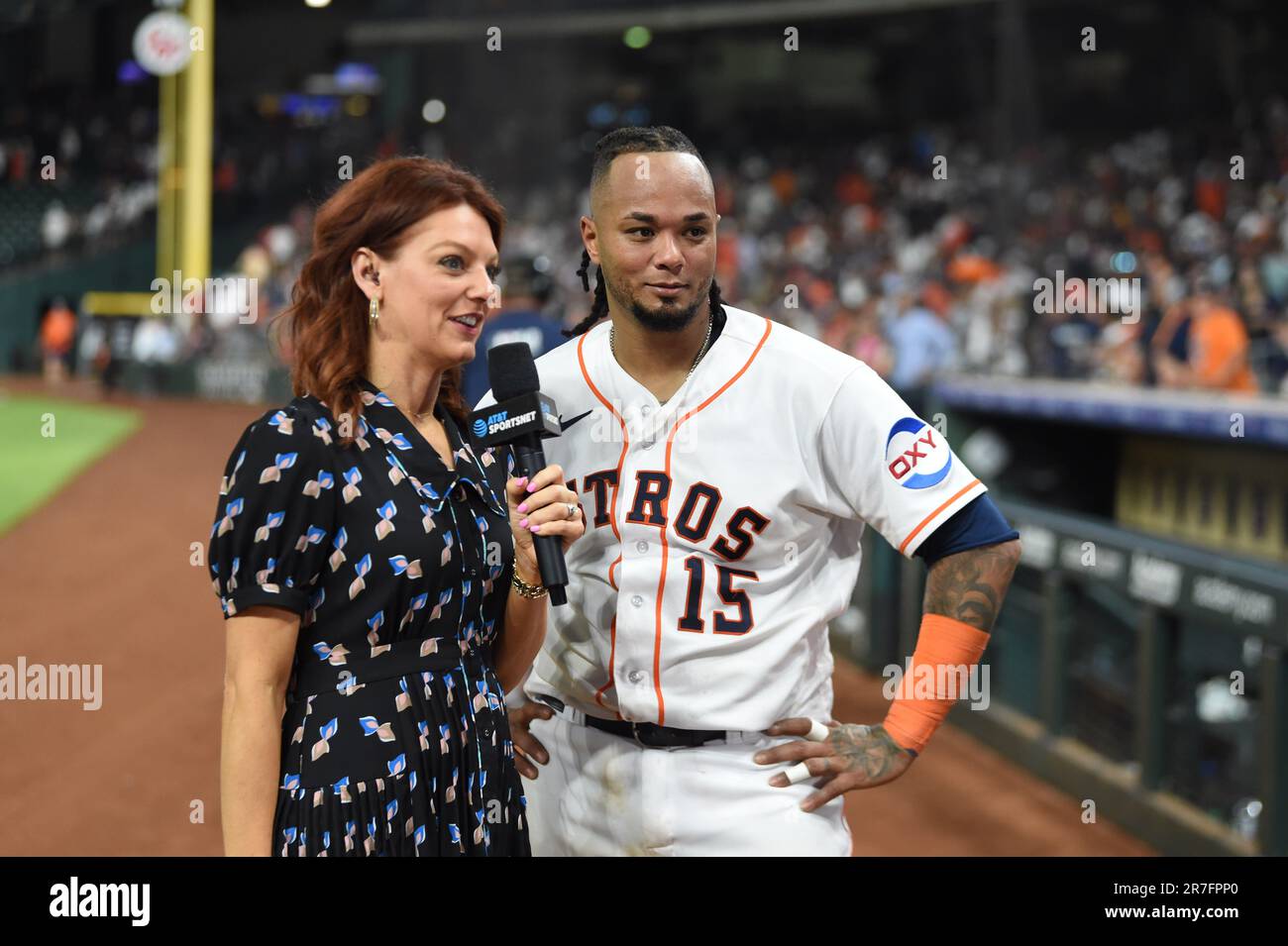 Houston Astros mascot Orbit has some fun with Julia Morales before the MLB  game between the Houston Astros and the New York Mets on Tuesday, June 21,  2022 at Minute Maid Park