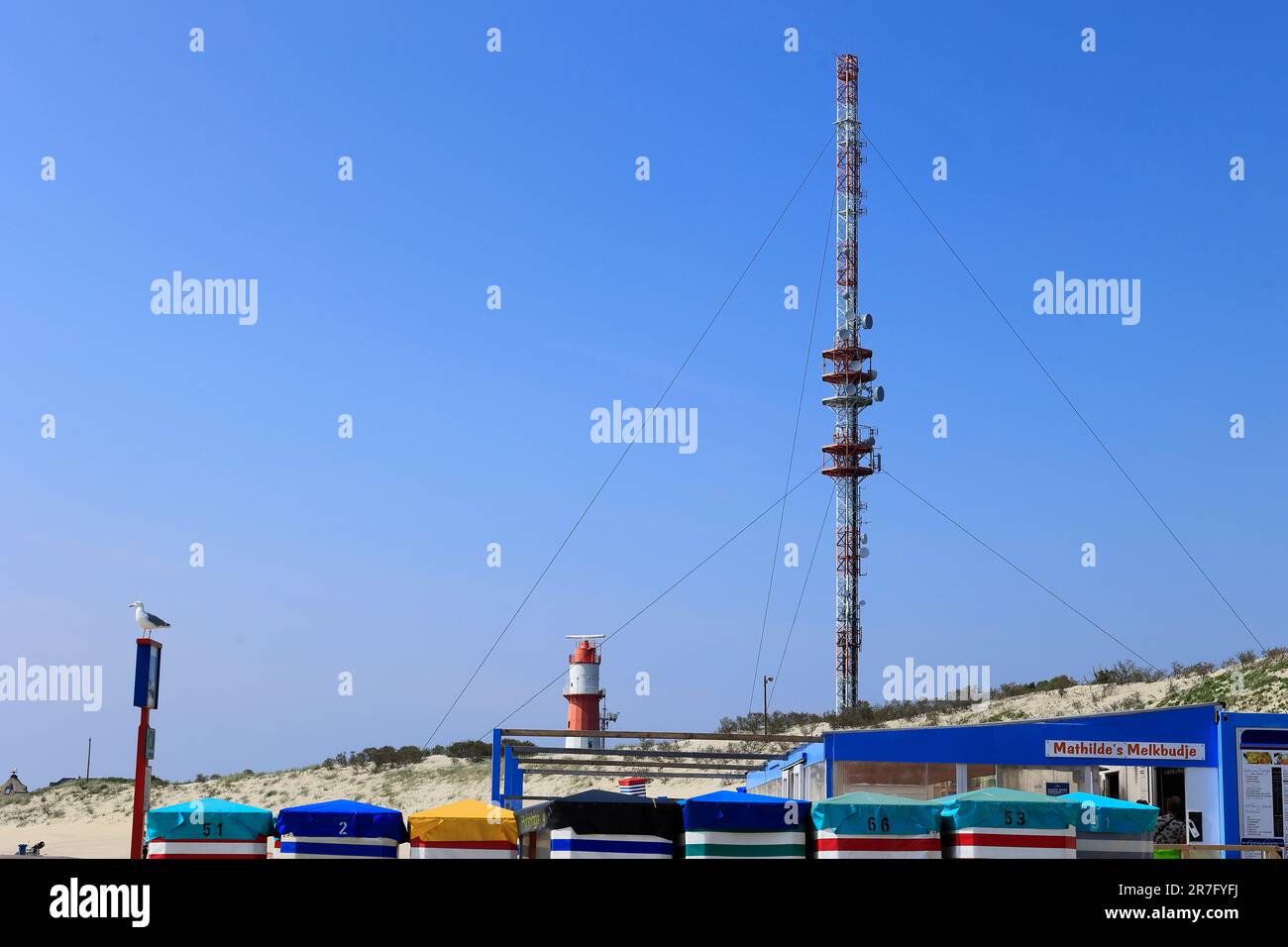 Electric lighthouse and new radio mast on Borkum beach Stock Photo