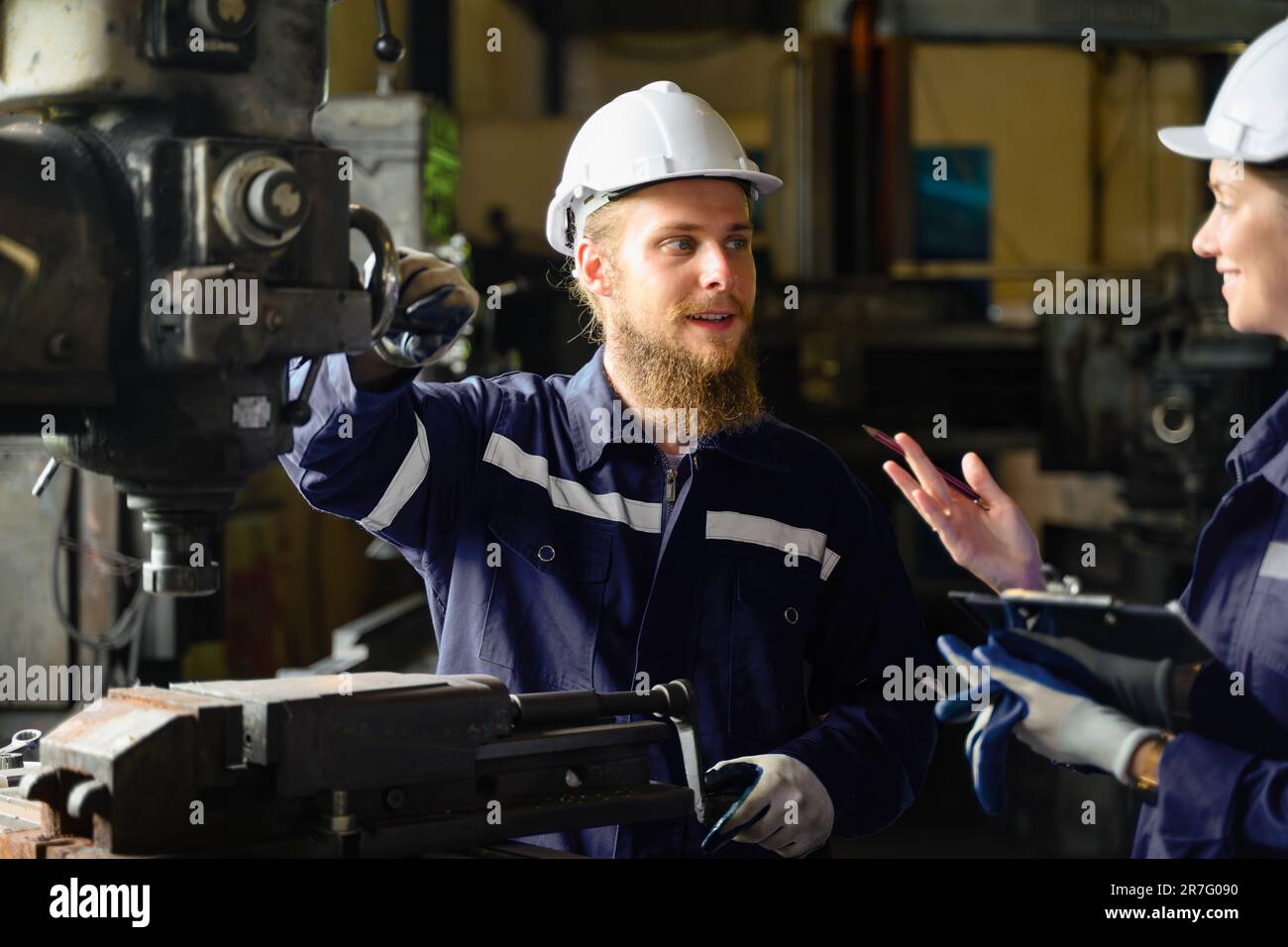 Engineer Reparing Machine Mechanical engineers repairing engine machine at factory Stock Photo ...