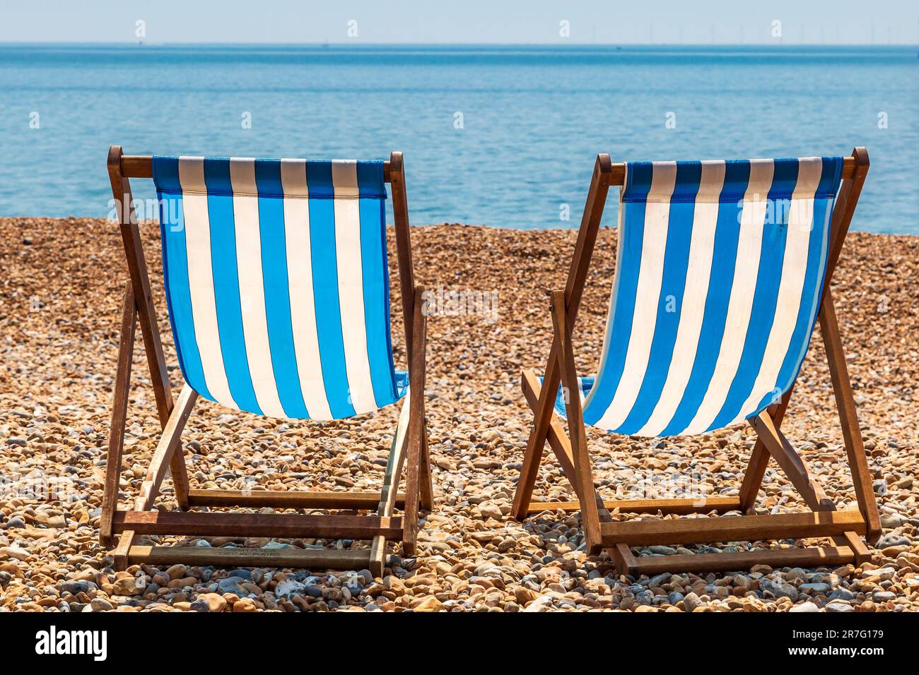 Two deck chairs on brighton beach hi-res stock photography and images ...