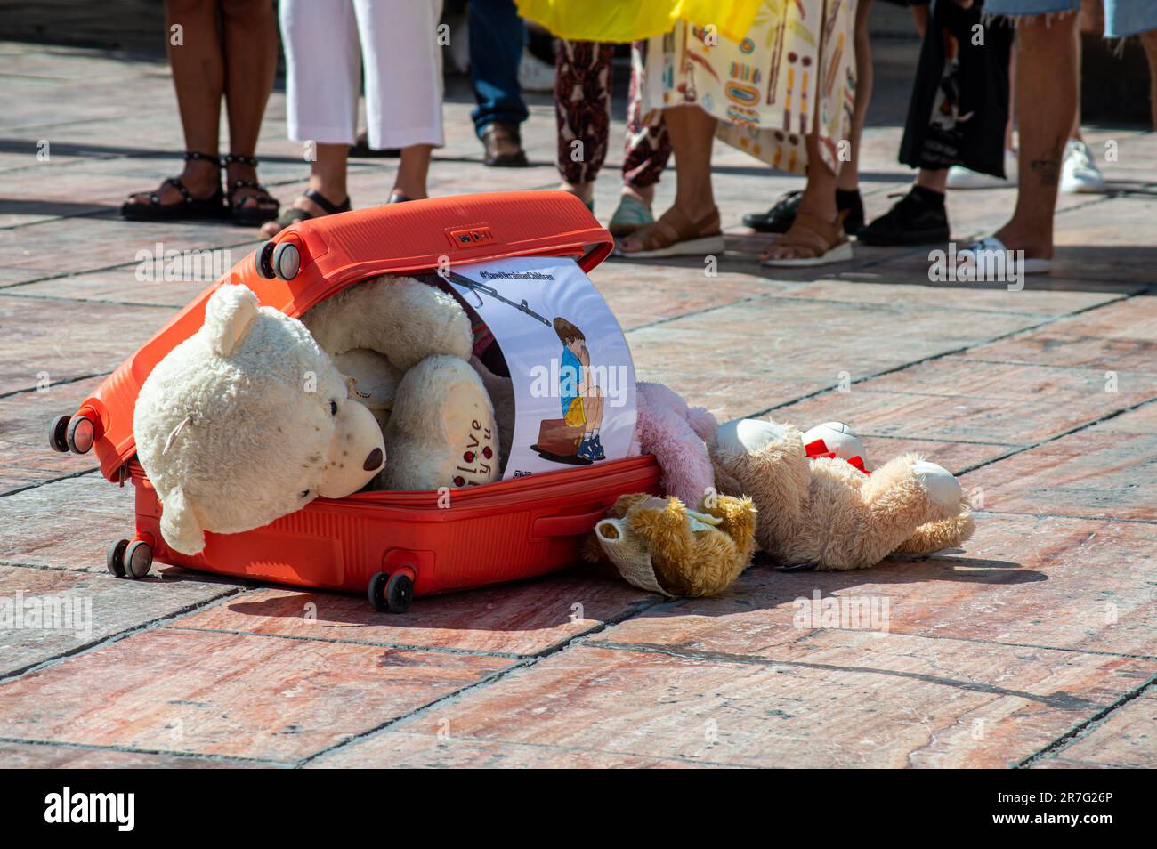 MALAGA, SPAIN - June 6, 2023: Toys in suitcase - support Ukraine children from russian argession on Constitution square in Malaga, Spain on June 6, 20 Stock Photo