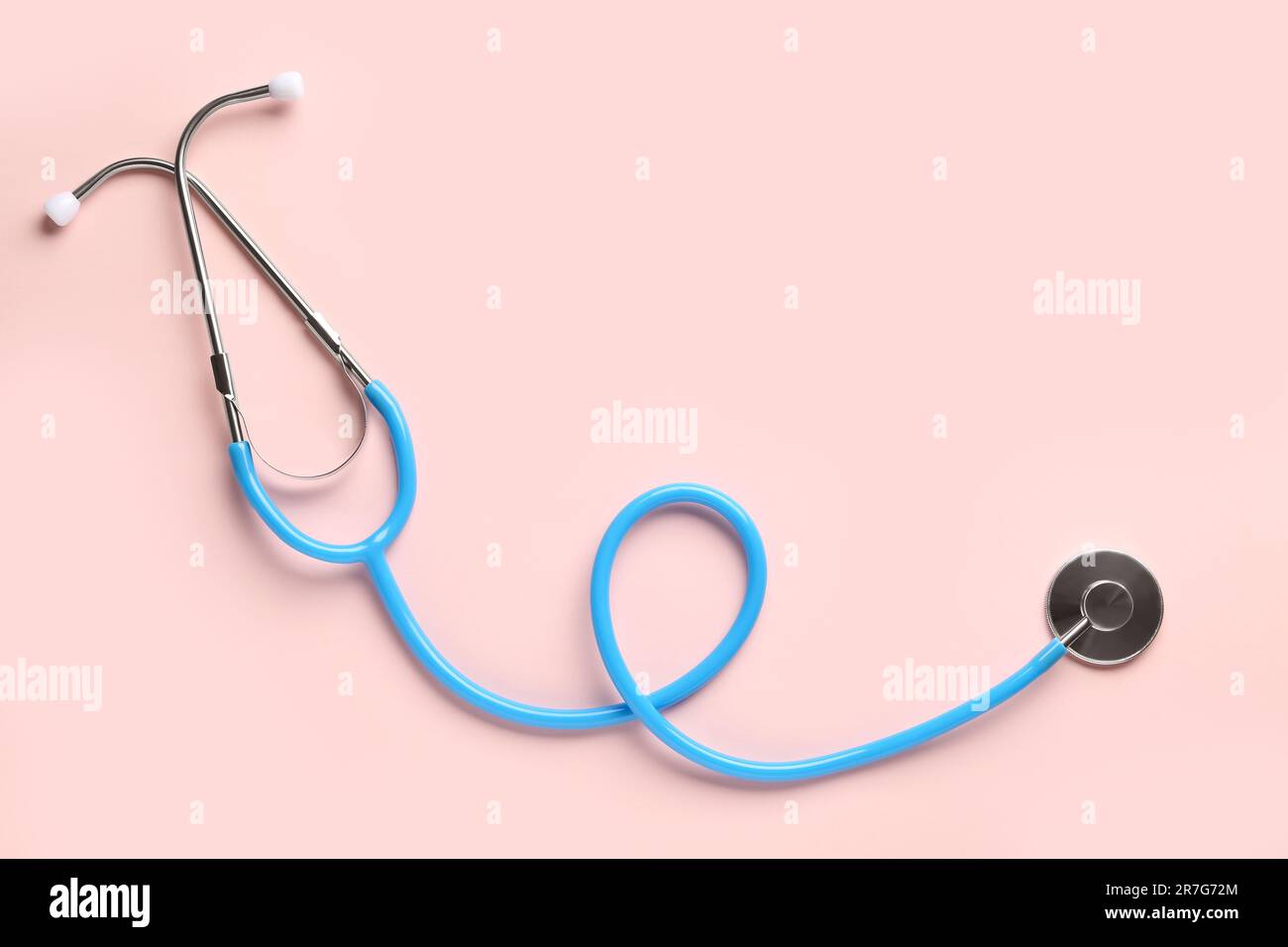 Modern stethoscope on pink background Stock Photo - Alamy