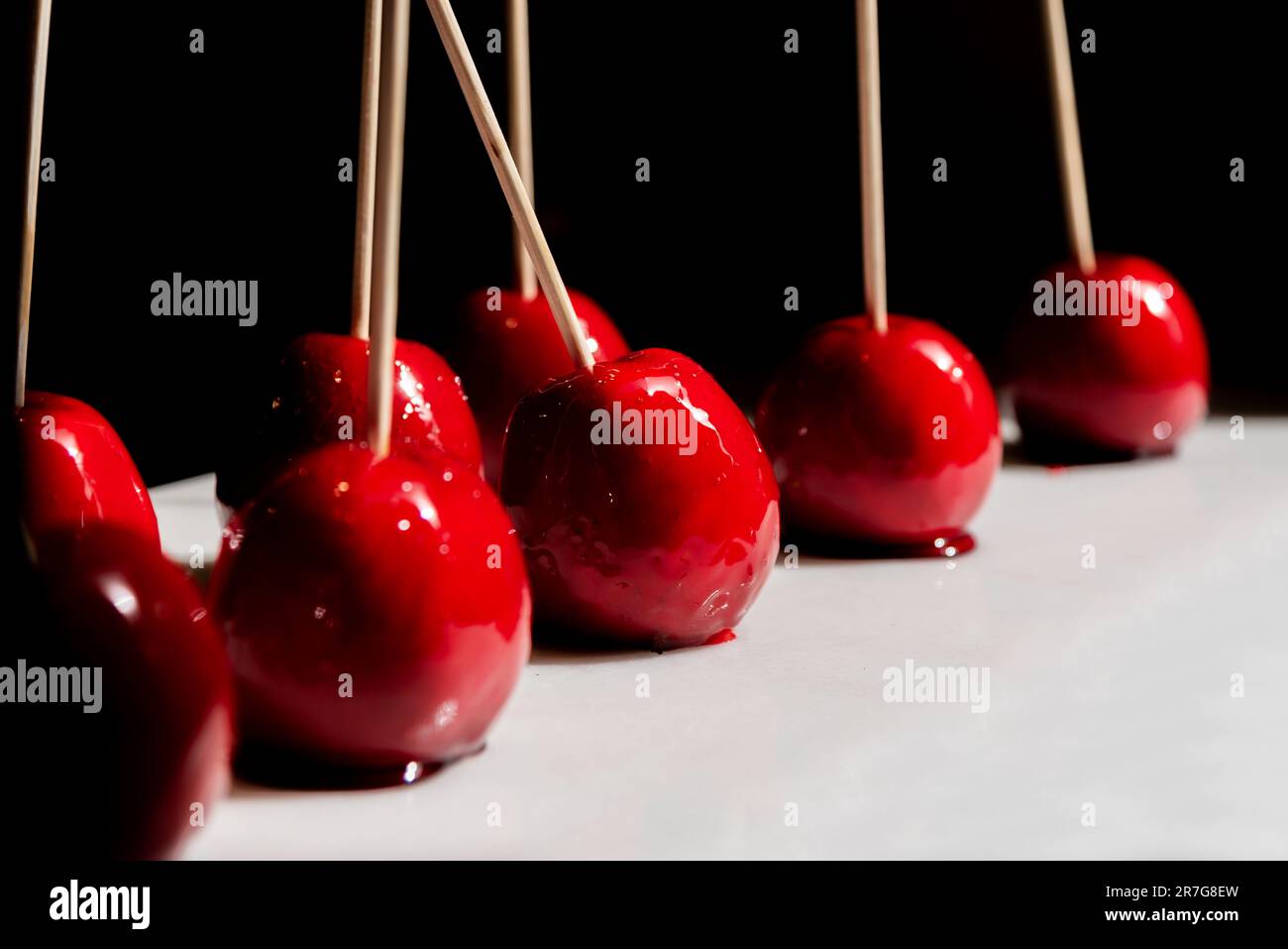 Close-up of apples covered with caramel. Sweet dessert with apples Stock Photo
