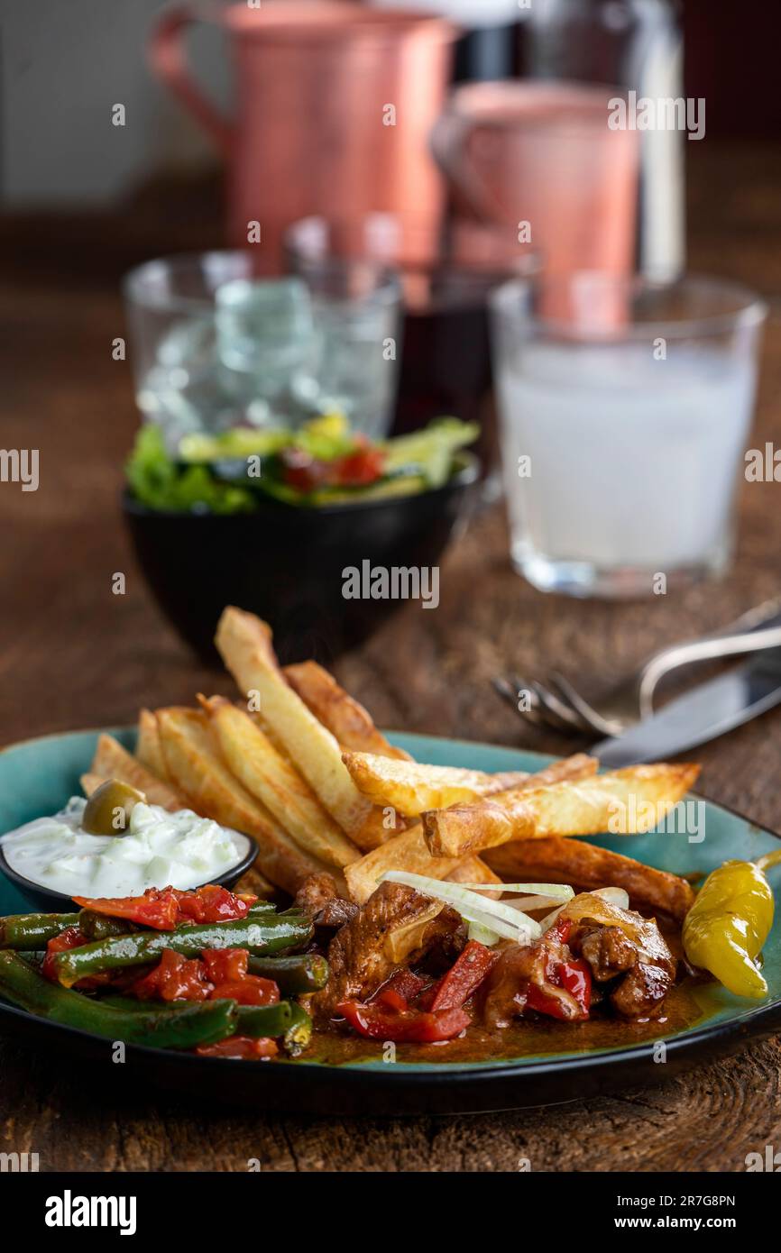 greek gyros with metaxa sauce and fries Stock Photo Alamy
