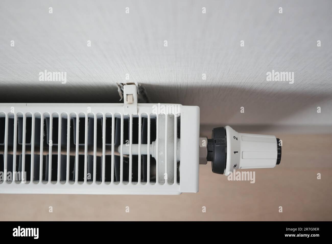 heating radiator under window in the room Stock Photo - Alamy
