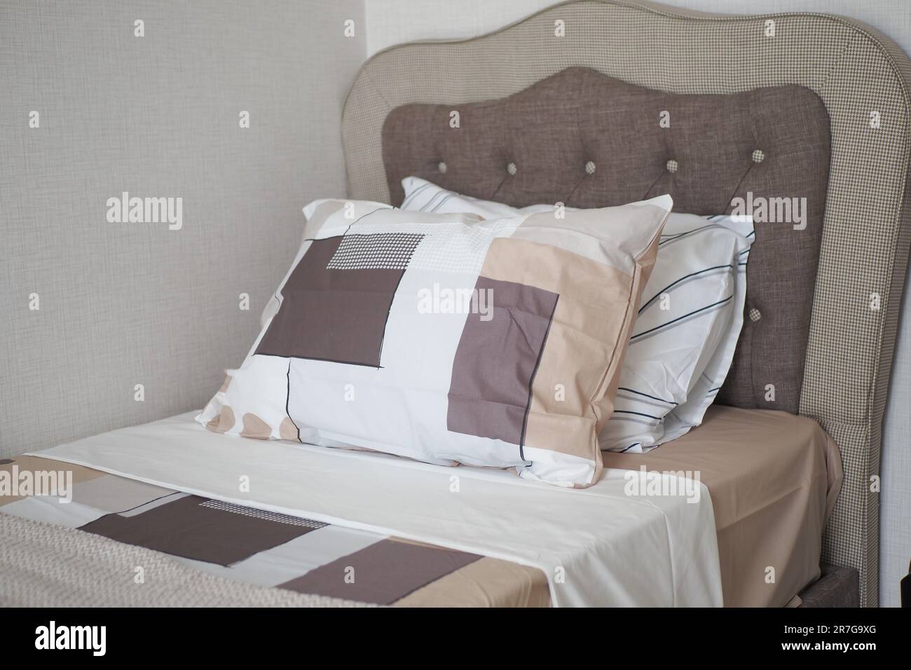 white pillow lined up on bed Stock Photo