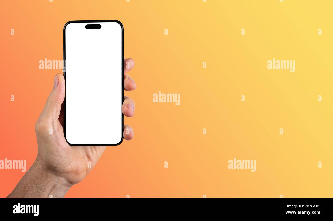 Lodz, Poland June 14 2023 hand holding iphone 14 pro max smartphone screen mockup. Banner background. Stock Photo