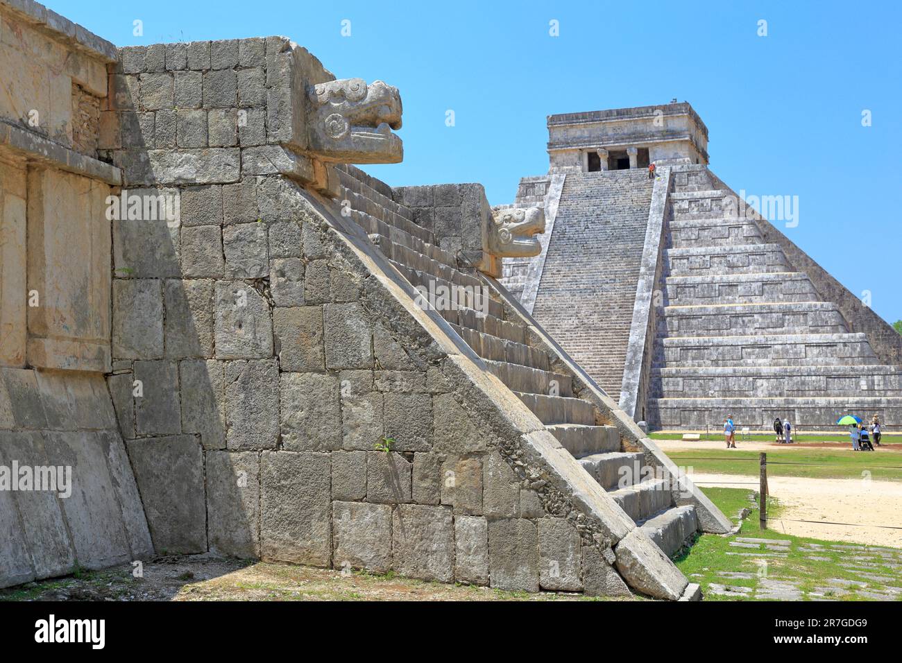 The Platform of the Eagles and Jaguars and the Castle, El Castillo or Pyramid of Kukulcan at Chichen Itza, Yucatan, Yucatan Peninsular, Mexico. Stock Photo