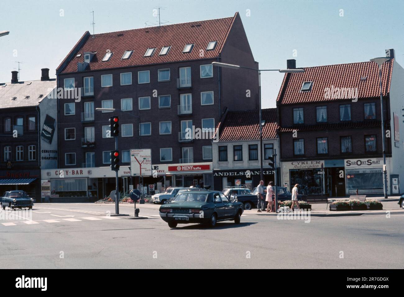 Vejle, Denmark- September 1973: View of buildings and shops at intersection of Sønderbrogade and Dæmningen streets in Vejle, Denmark. Manne cigars Stock Photo
