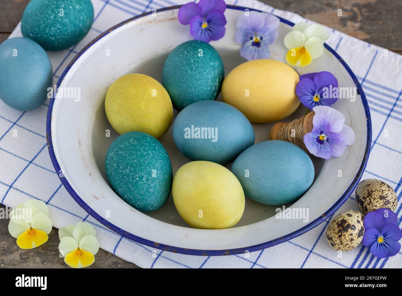 easter painted eggs on the old enamel plate Stock Photo