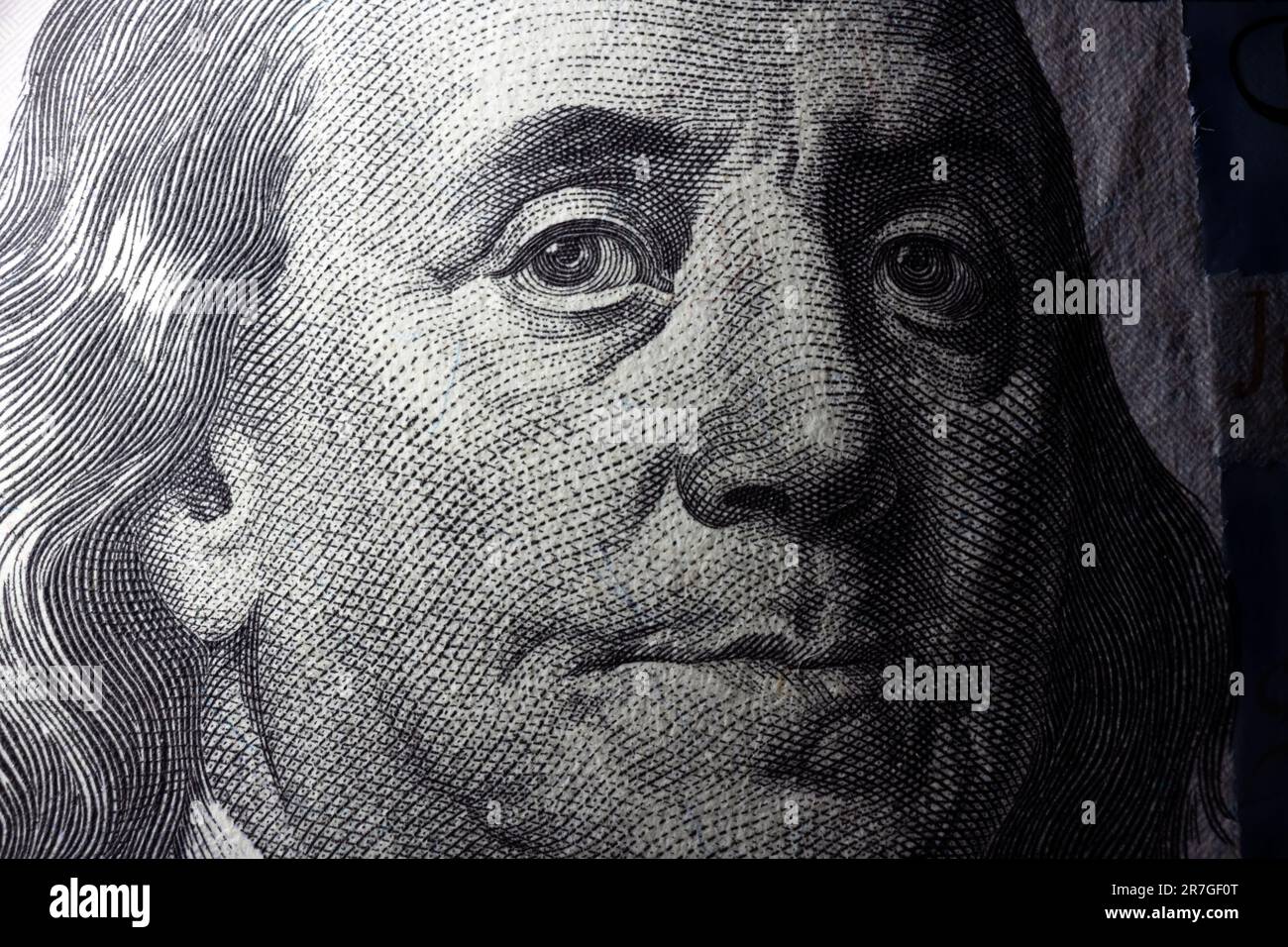 100 dollar bill with Benjamin Franklin face macro shot. Close up