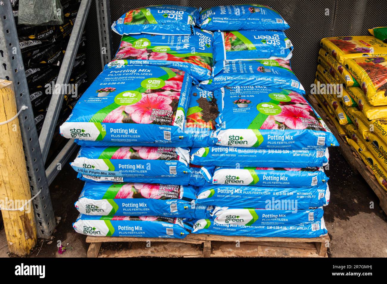 Stacked bags of potting mix with fertilizer, sta-green brand, for sale at a garden center in Wichita, Kansas, USA. Stock Photo