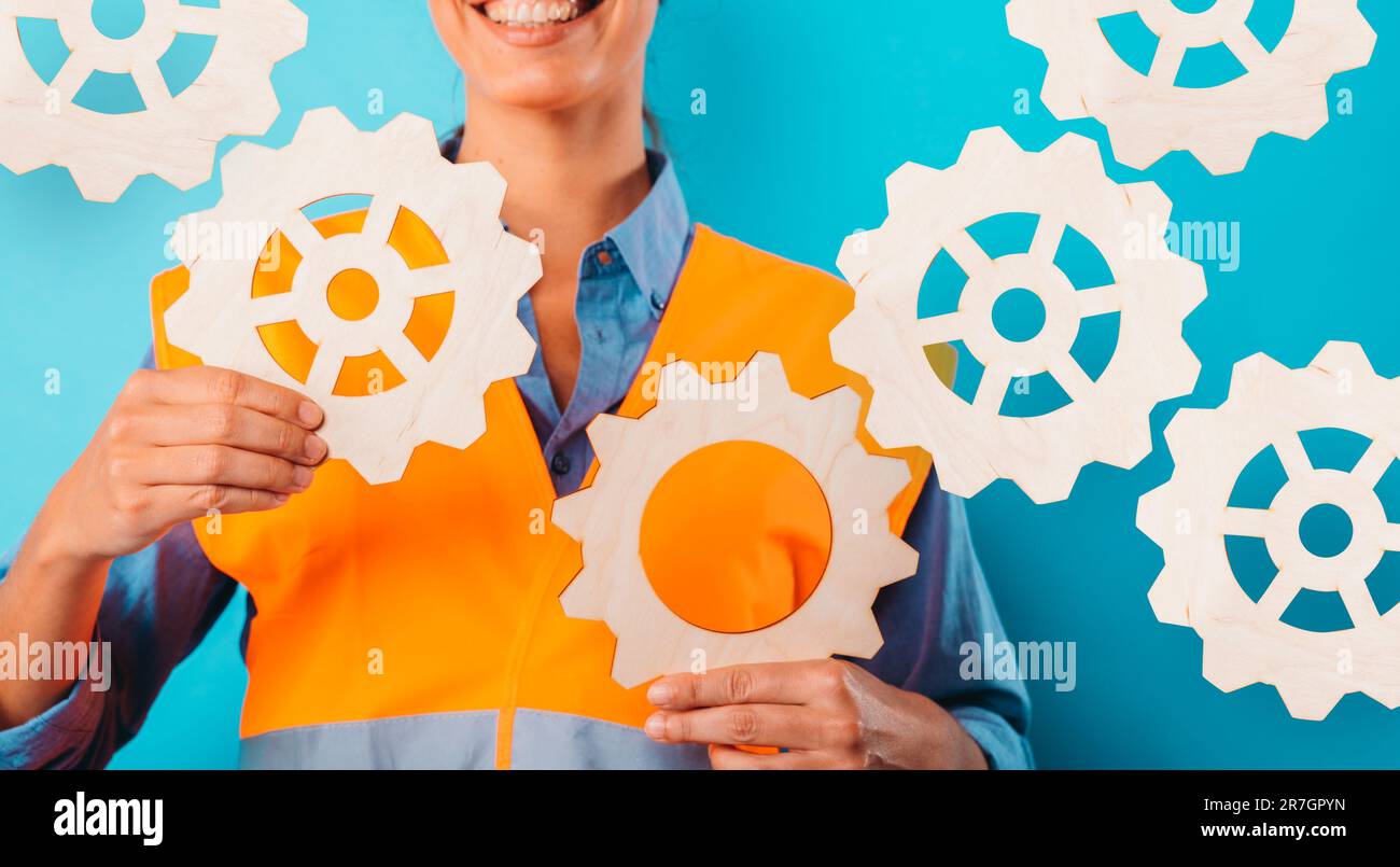 Woman worker gears hi-res stock photography and images - Alamy