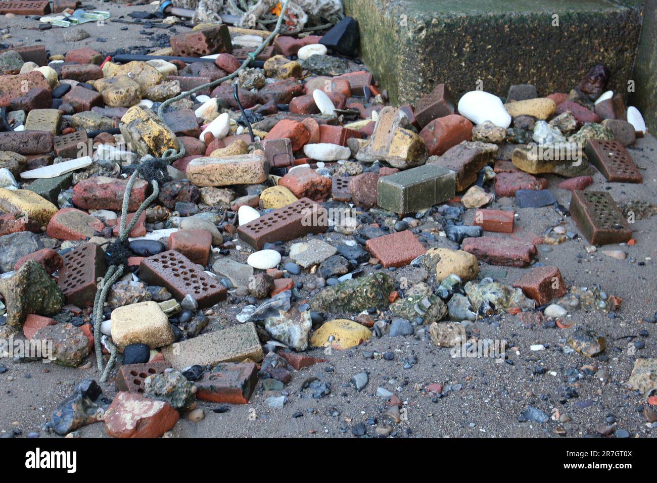 Pollution washed assure onto the beach - environmental harm to wildlife and its eco system - In London along the River Thames Stock Photo