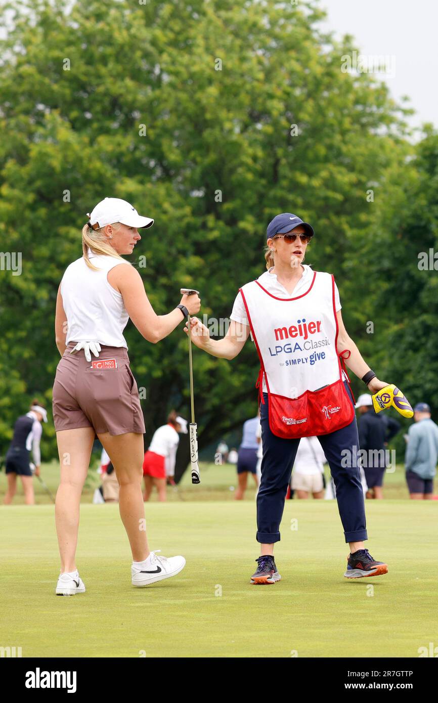 GRAND RAPIDS, MI - JUNE 15:The caddie for LPGA golfer Frida Kinhult hands  the putter to her caddie after making a birdie putt on the 2nd hole on June  15, 2023, during