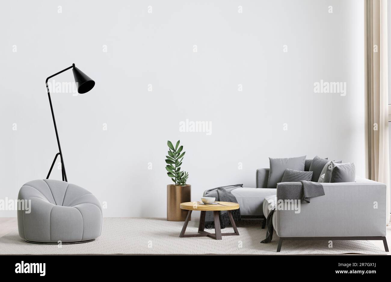 A contemporary living room with a grey sofa, coffee table, lamp, and a ...