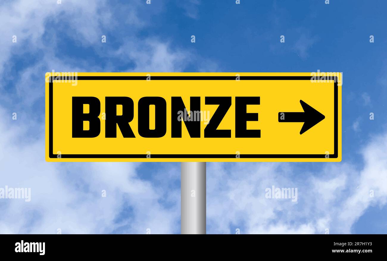 Bronze road sign on cloudy sky background Stock Photo - Alamy
