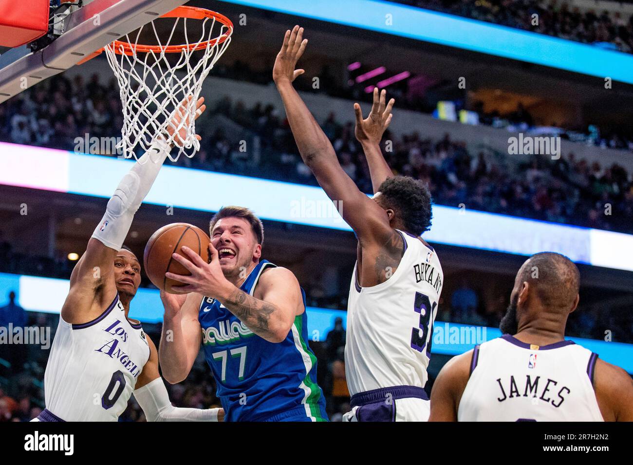 Dallas Mavericks guard Luka Doncic (77) goes up for a shot while Los ...