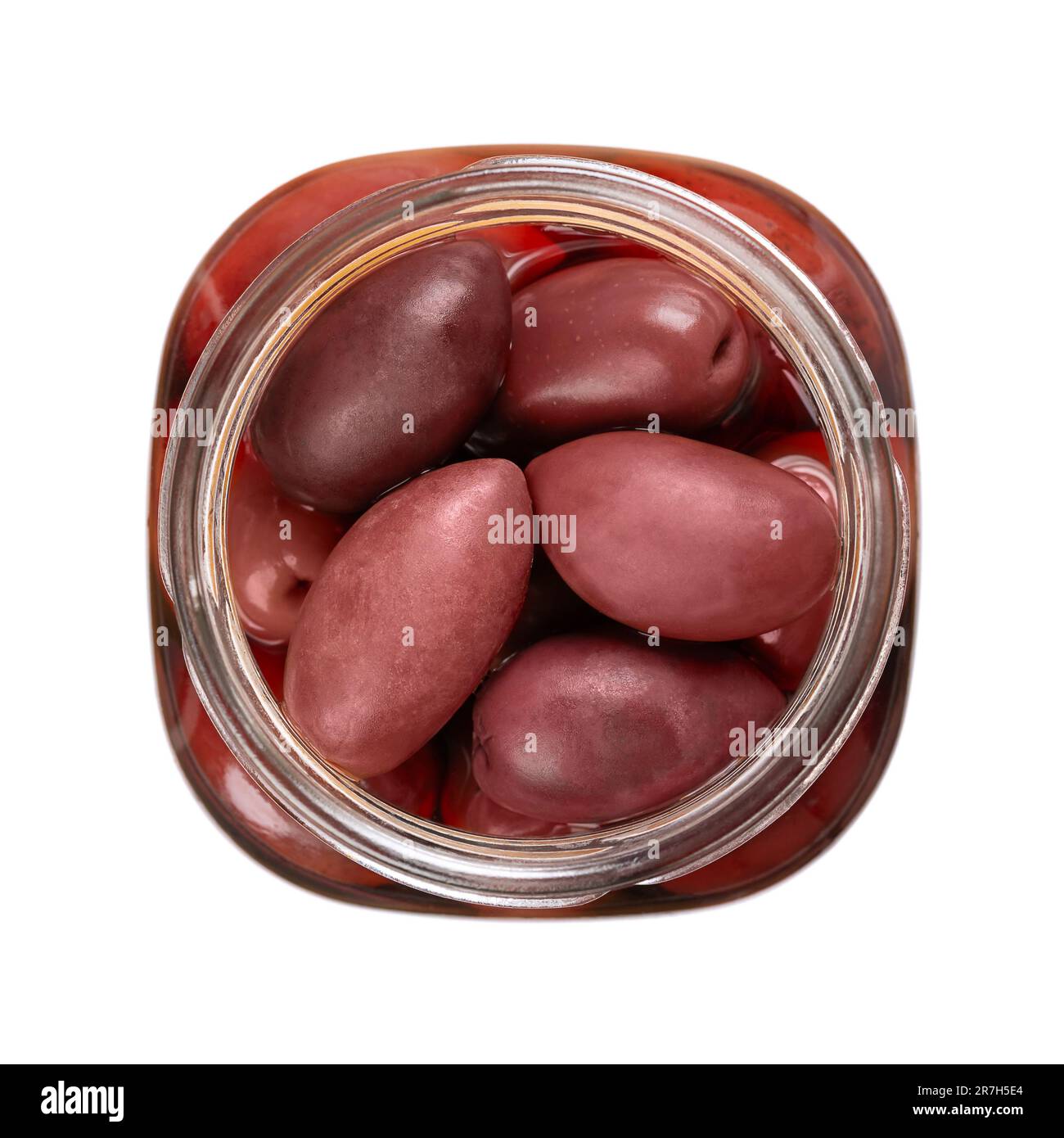 Kalamata olives in an open jar, from above. Whole, large and dark purple table olives from the Kalamata region in Greece. Stock Photo