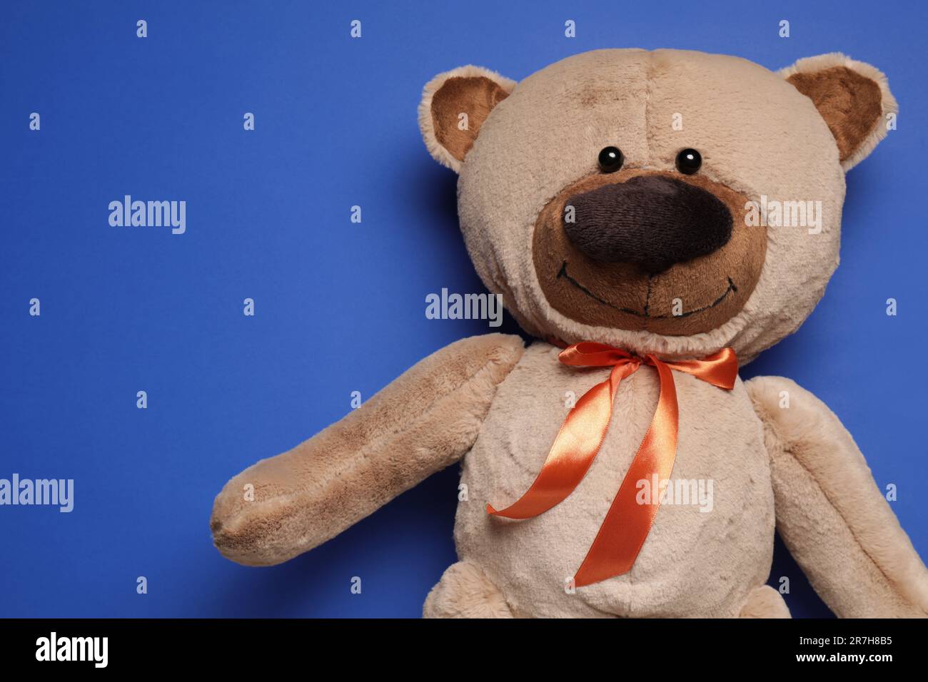 Cute teddy bear on blue background, top view. Space for text Stock ...