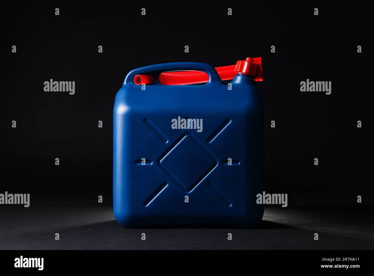 New blue plastic canister on black background Stock Photo Alamy