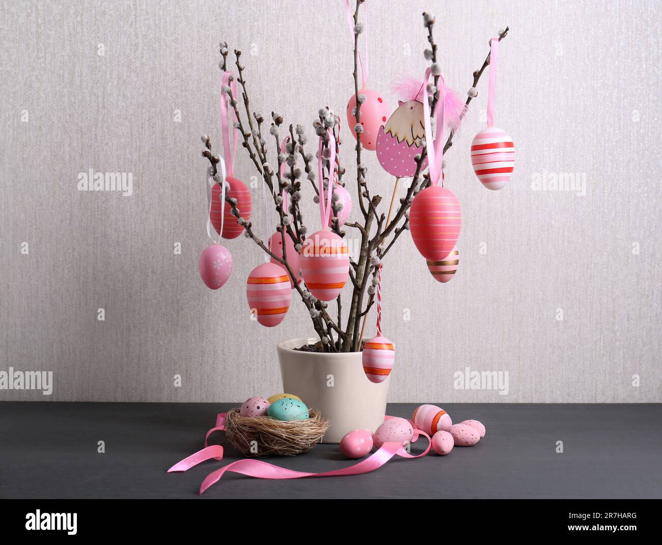 Beautiful willow branches with painted eggs and Easter decor on light ...