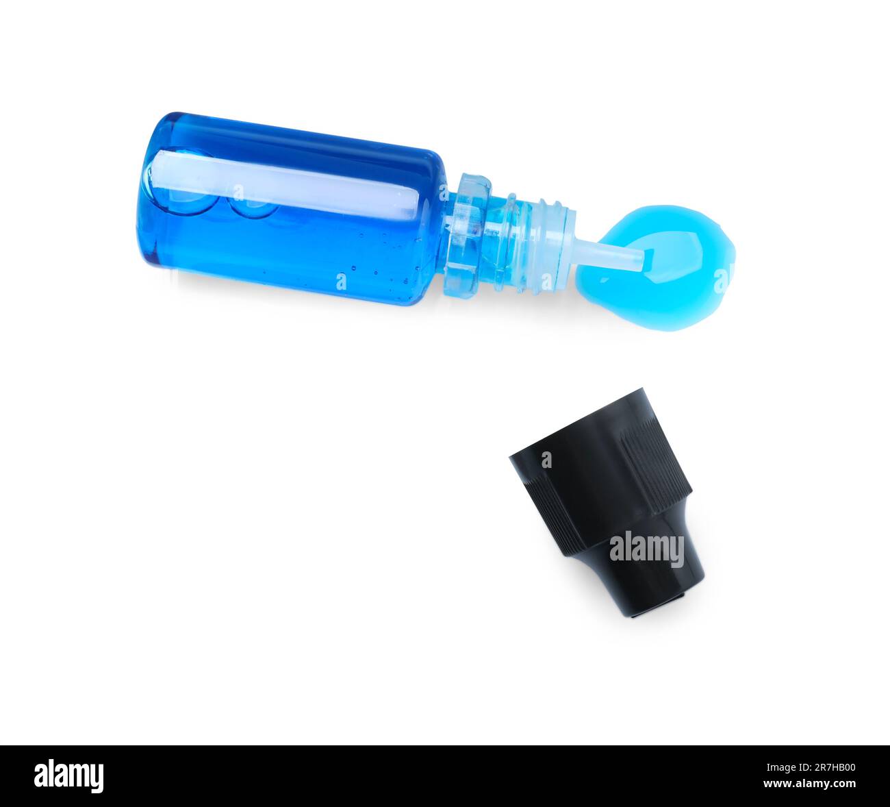 Bottle with light blue food coloring isolated on white, top view Stock ...