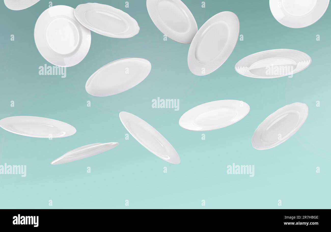 Many white plates falling on pastel teal background Stock Photo - Alamy