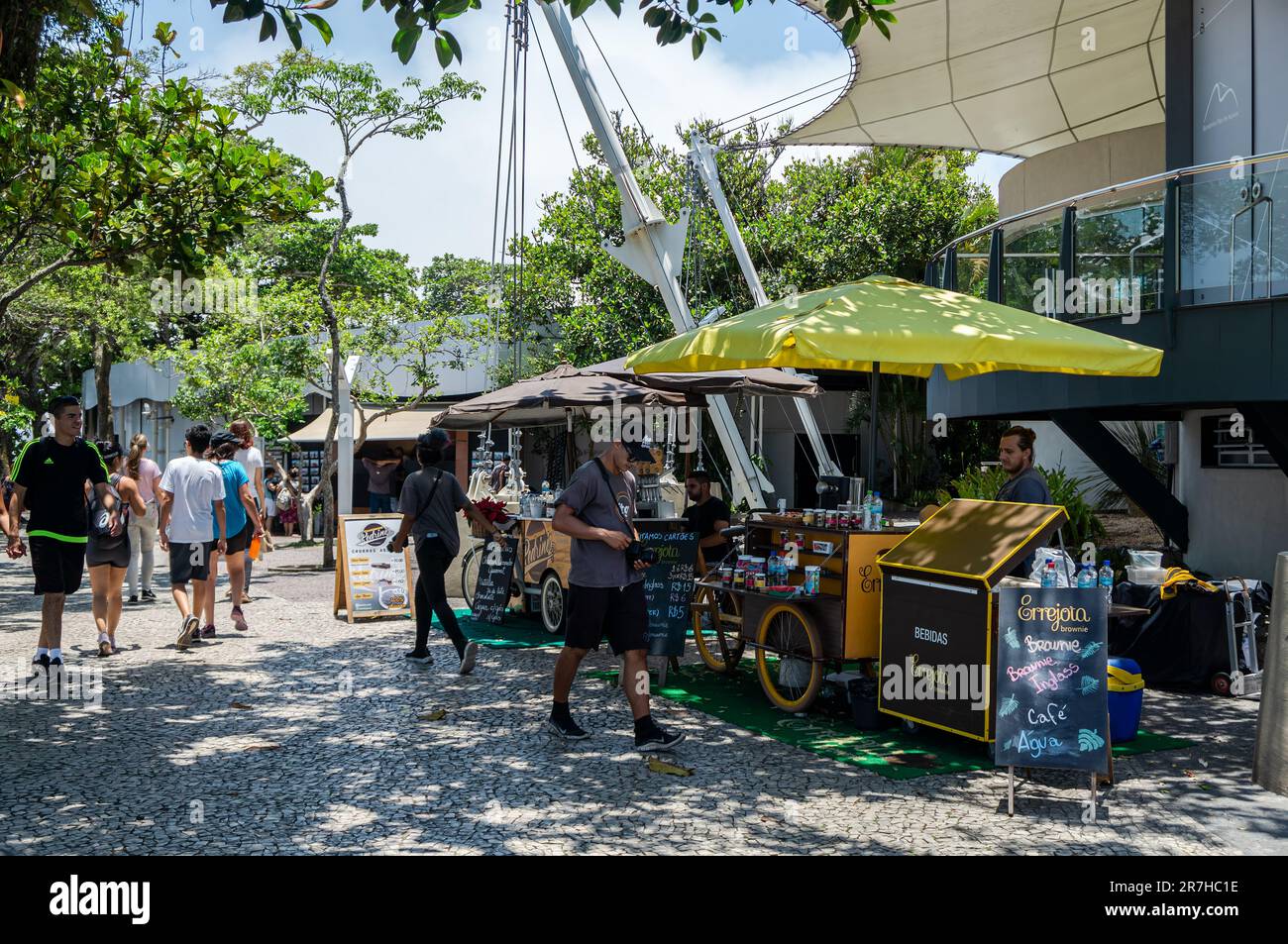 Food carts with big umbrellas selling sweets, food and drinks on summit outdoor area of Urca