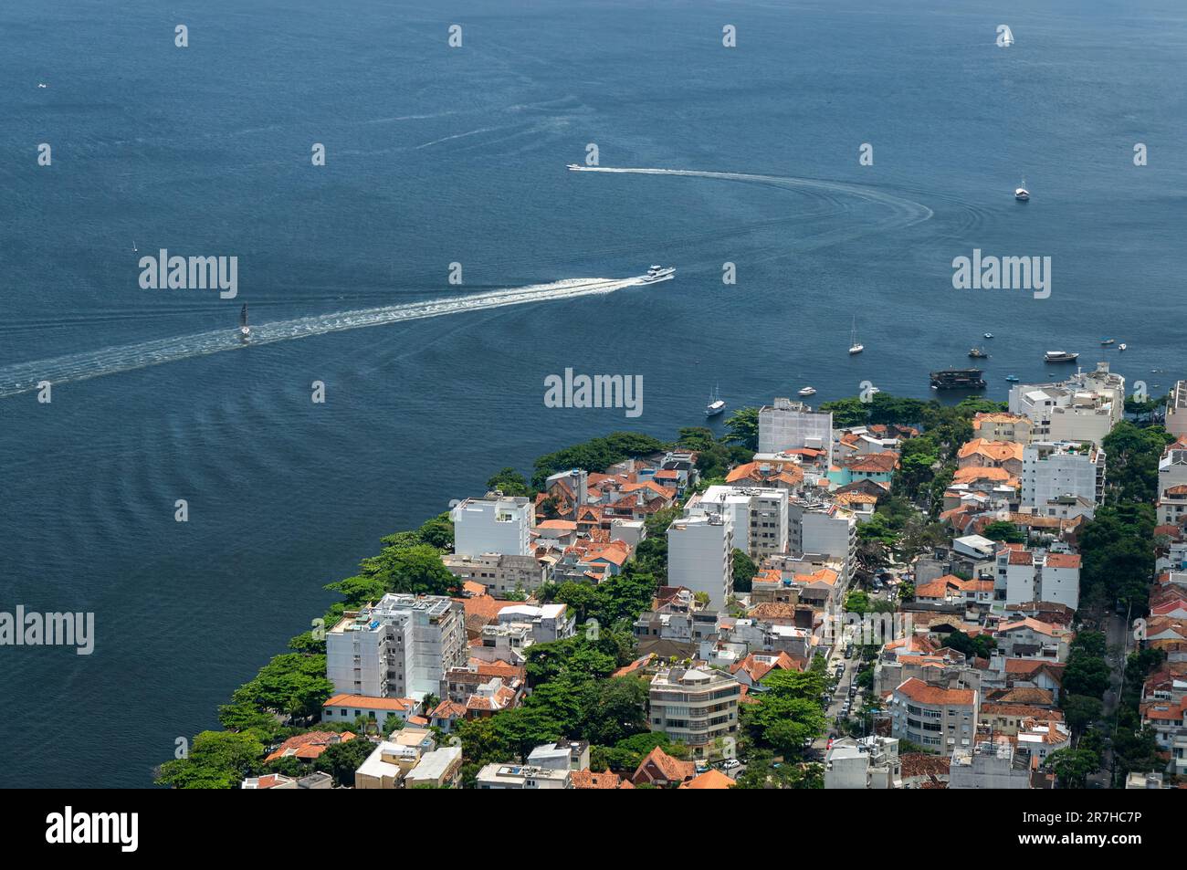 View of Botafogo district coastline with Guanabara bay waters full of  sailboats and vessels anchored nearby the Yatch Club under summer sunny day  Stock Photo - Alamy