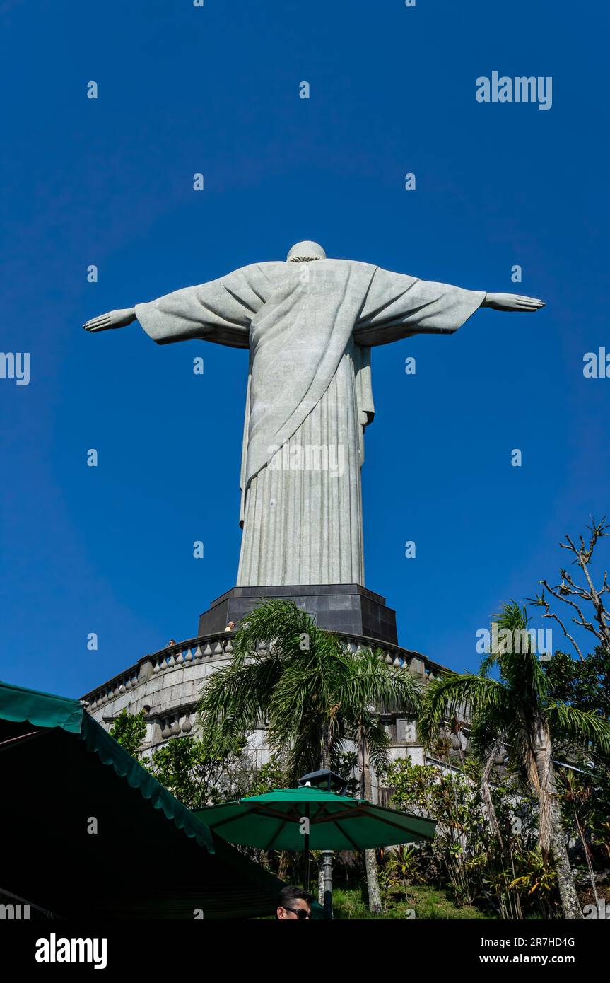 Full backside of the Christ the Redeemer statue saw from the staircase of Corcovado mountain in